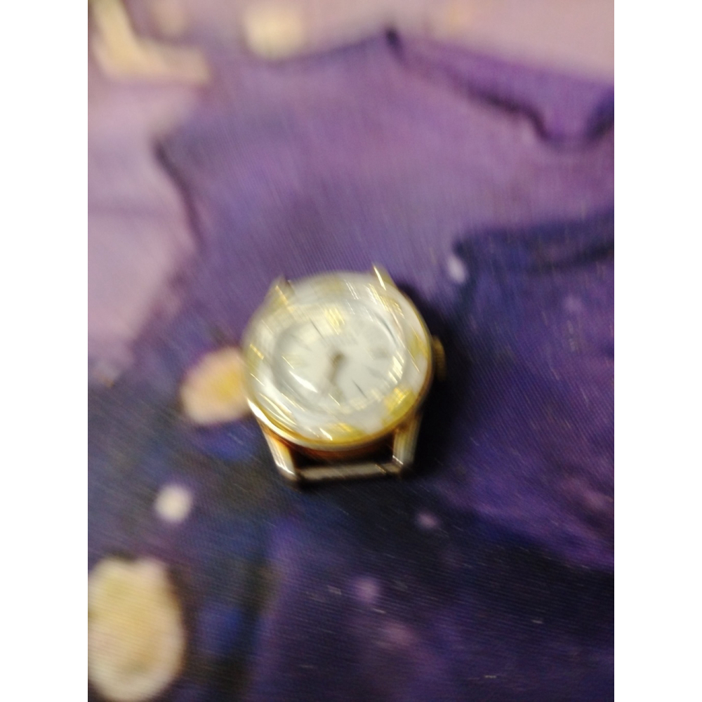 Vintage Manson Gold-Tone Watch with White Enamel Finish and Ornate Leaf Detail